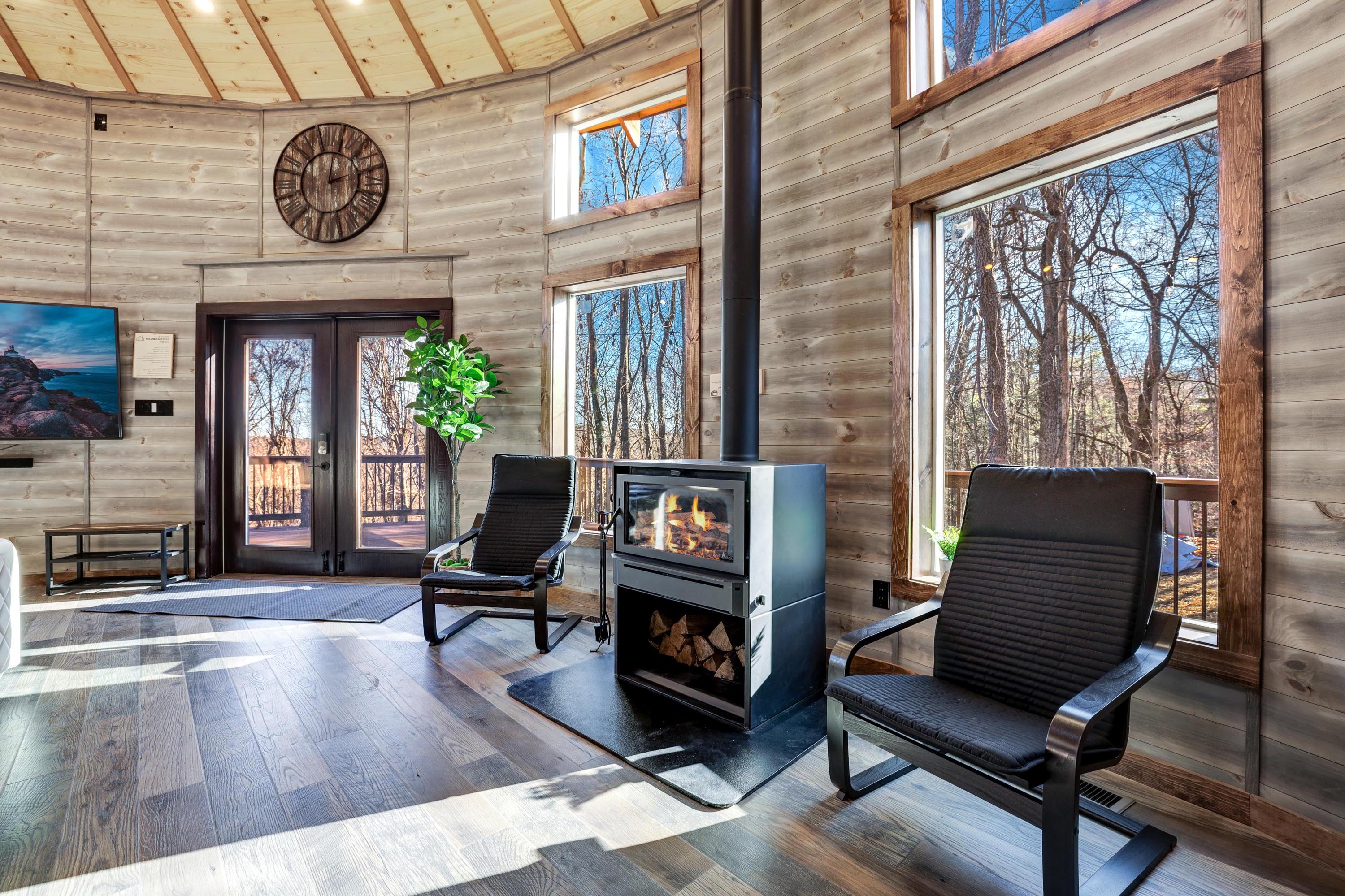 <span  class="uc_style_uc_tiles_grid_image_elementor_uc_items_attribute_title" style="color:#ffffff;">Two rocking chairs and a wood stove.</span>
