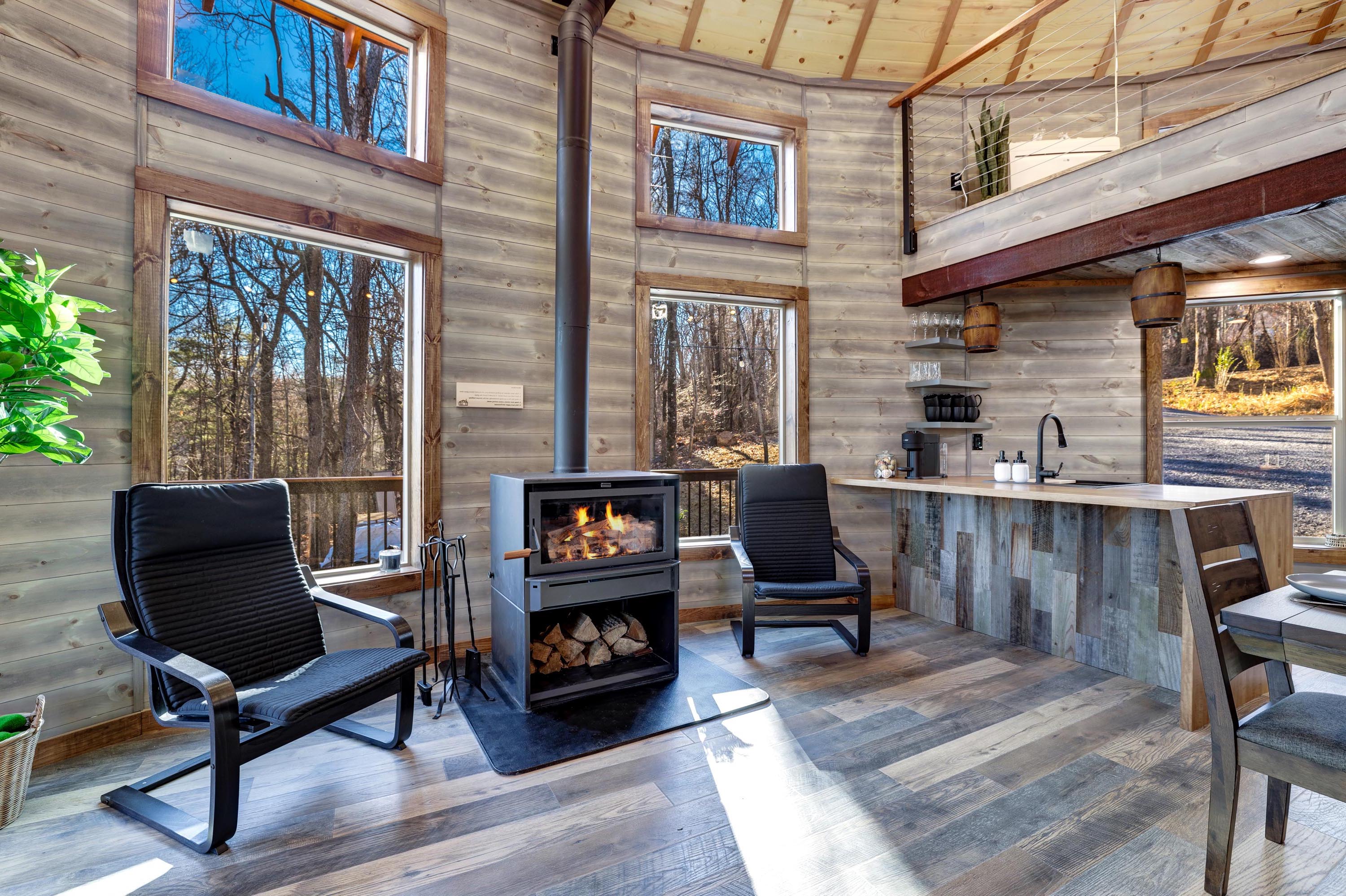 <span  class="uc_style_uc_tiles_grid_image_elementor_uc_items_attribute_title" style="color:#ffffff;">Two rocking chairs and a wood stove</span>