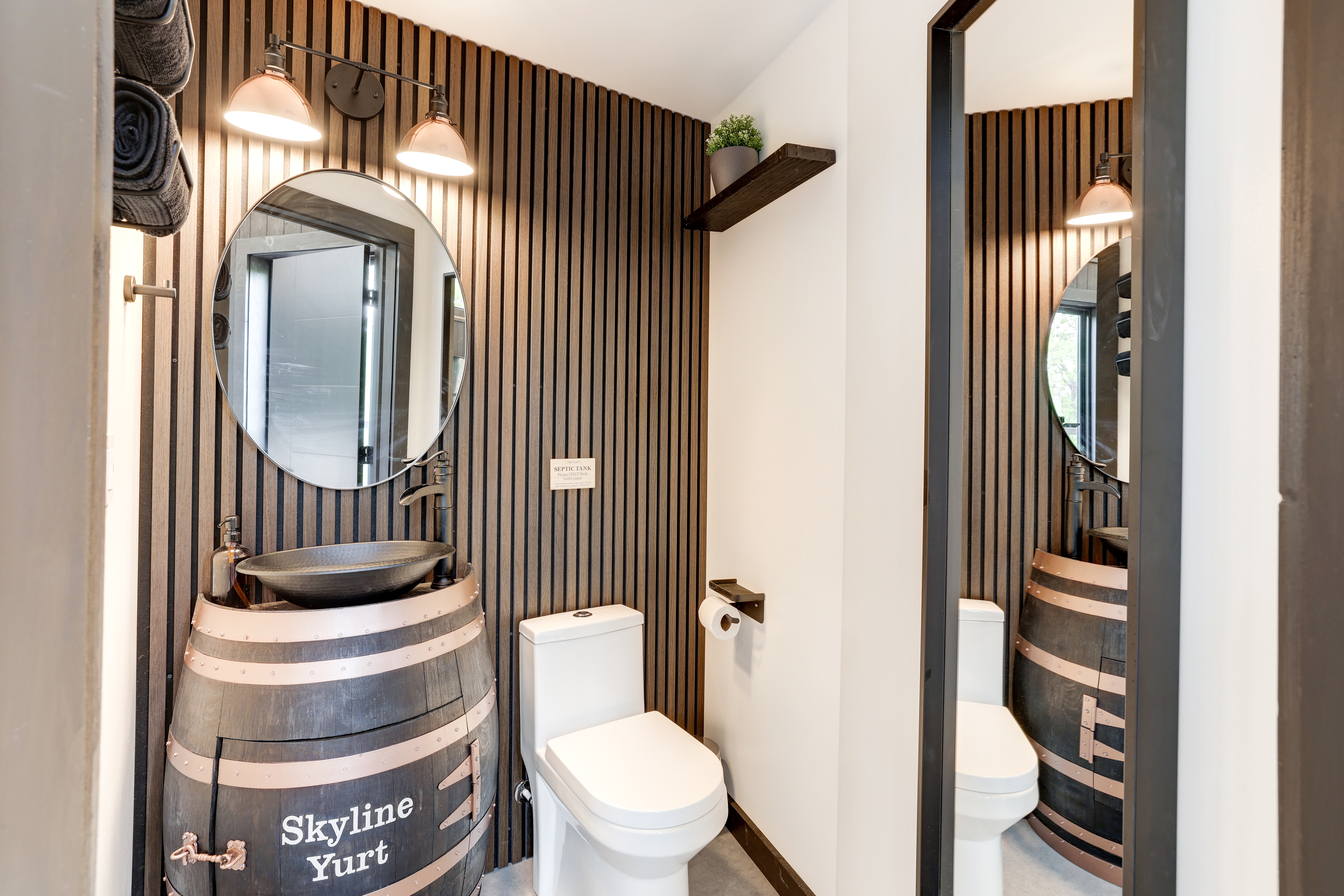 <span  class="uc_style_uc_tiles_grid_image_elementor_uc_items_attribute_title" style="color:#ffffff;">Cozy Modern Second Bathroom, Half-Barrel Sink, Large Mirror, and Towels - Skyline Yurt</span>