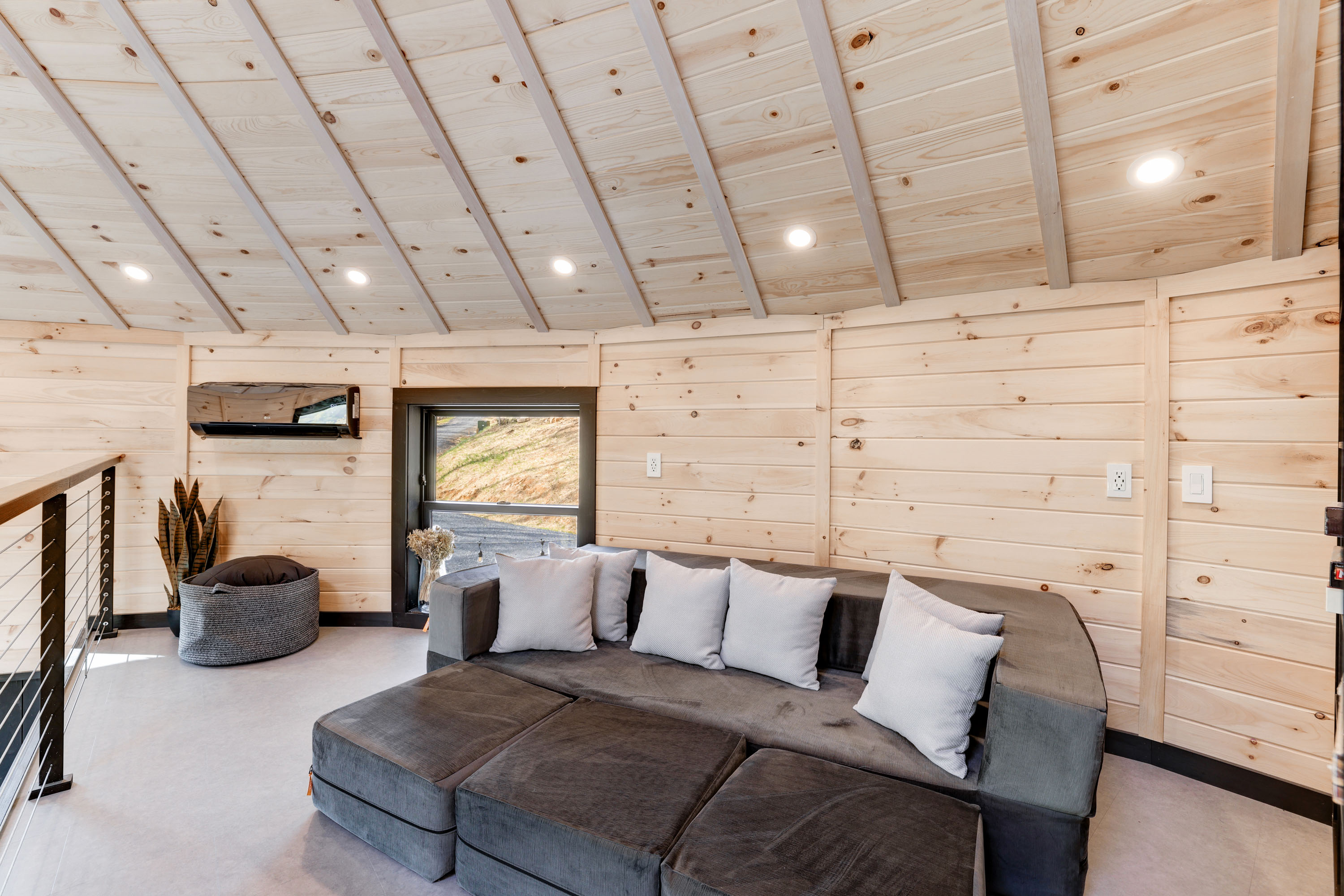 <span  class="uc_style_uc_tiles_grid_image_elementor_uc_items_attribute_title" style="color:#ffffff;">King-Size Sleeper Sofa in Climate-Controlled Loft - Skyline Yurt</span>