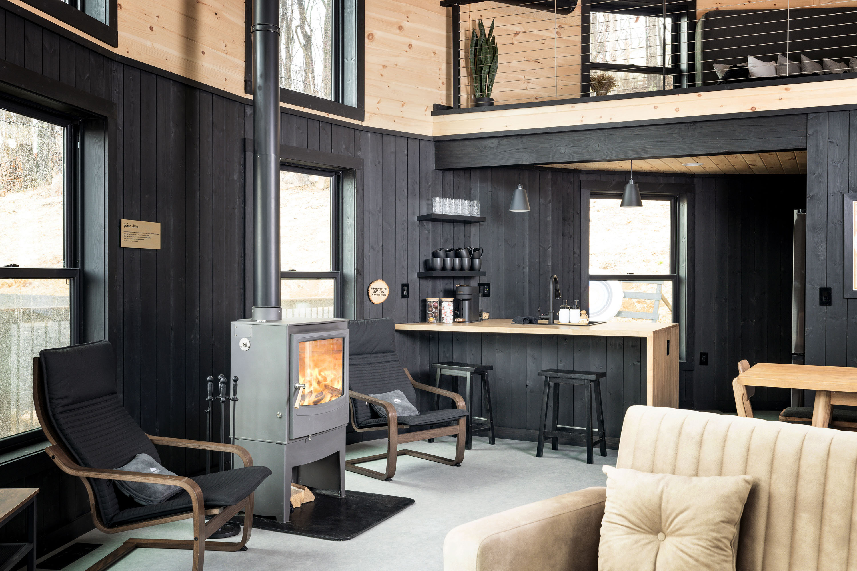 <span  class="uc_style_uc_tiles_grid_image_elementor_uc_items_attribute_title" style="color:#ffffff;">Lounger Chairs, Wood Stove, Kitchen Island, Modern Black-Yellow Interior, Sofa - Skyline Yurt</span>