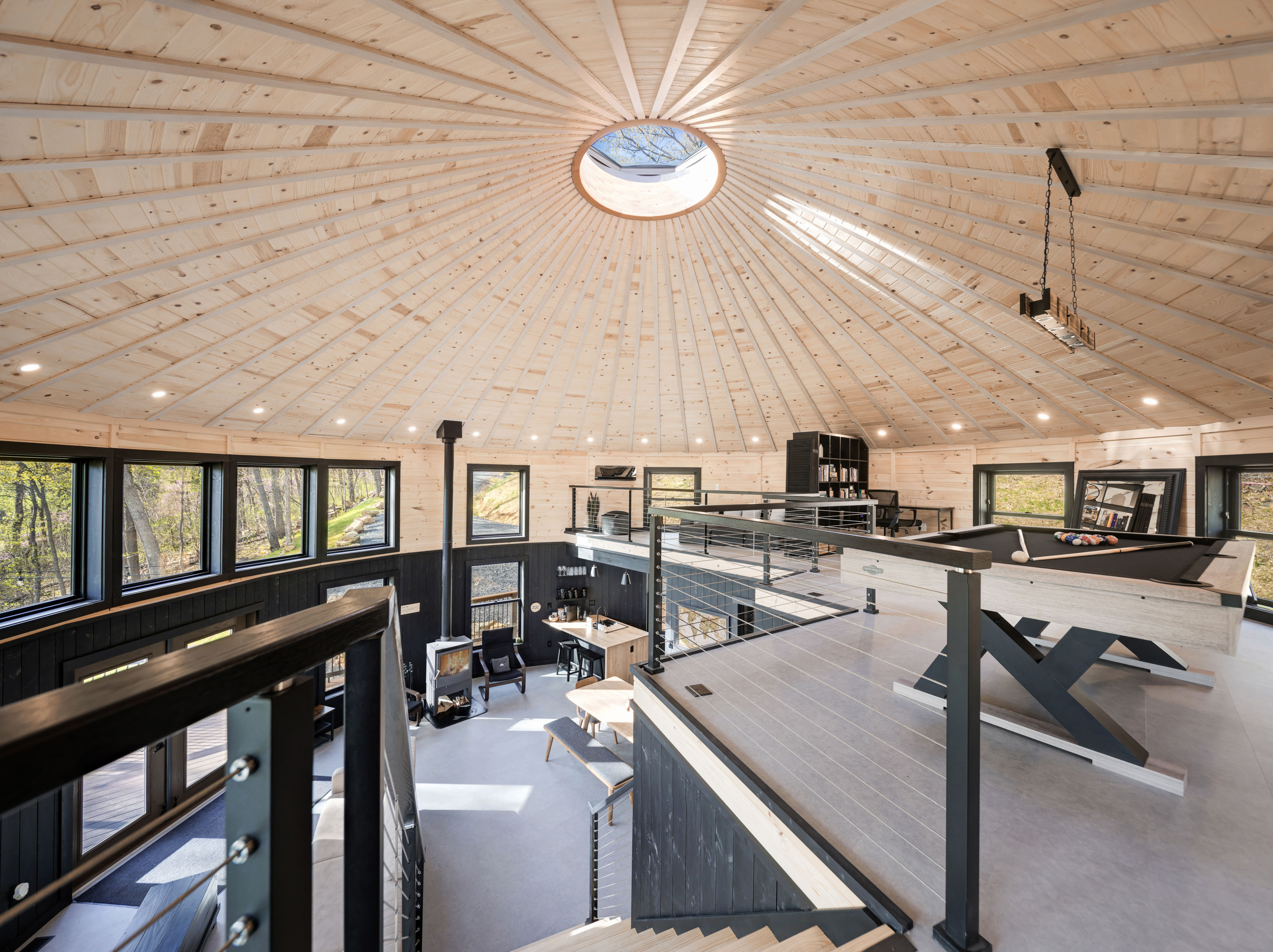 <span  class="uc_style_uc_tiles_grid_image_elementor_uc_items_attribute_title" style="color:#ffffff;">View from Stairs, Pool Table, Yurt Ceiling, Bookshelf, Wood Stove, Lounge Chairs - Skyline Yurt</span>